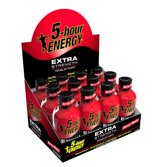 Display box of 5-hour Energy - Extra Strength from Vegas Party Favors, featuring bold berry flavor. Each small red bottle is high in caffeine, sugar-free, and has a black cap with labels showcasing the brand logo and energy silhouette. Available as a 12 pack.