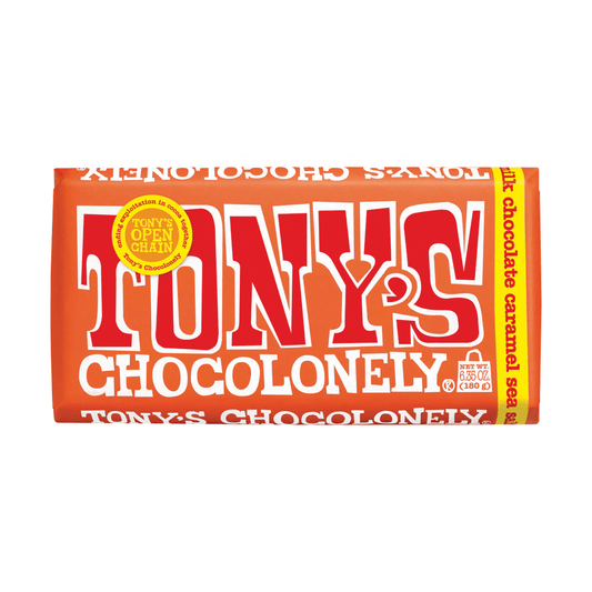 The image features a 6.3oz Tonys Chocolney Big Bar by Vegas Party Favors, boasting an orange wrapper with bold white and red letters. The design highlights Tonys Chocolonely, milk chocolate caramel sea salt, and Tonys Open Chain.