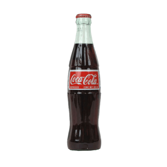 A classic 1L glass bottle of Mexican Coke by Vegas Party Favors, featuring a red and white label, filled with dark cola, and capped with a silver top.