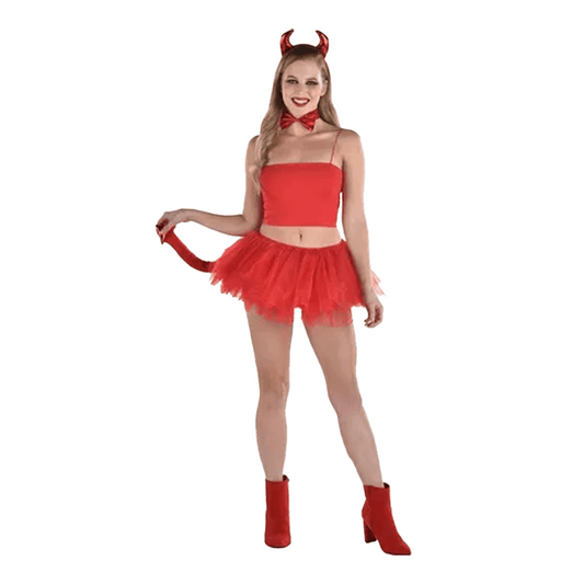 A person in the Vegas Party Favors Devil Accessory Kit, featuring red horns, a bow tie, strapless top, and playful red tutu skirt with matching boots, poses with a mischievous smile to effortlessly showcase their devilish look.