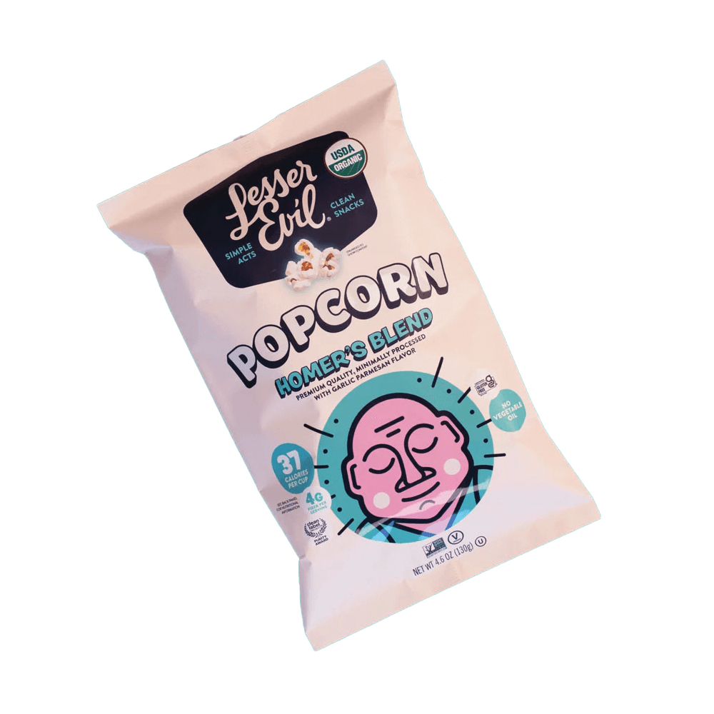 A pastel-colored bag of Vegas Party Favors LesserEvil Organic Popcorn, featuring the name Homers Blend, highlights 37 calories per cup, USDA organic, and clean snacks with a stylized cartoon face on the front.