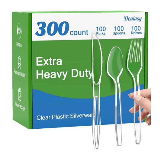 The Vegas Party Favors 300 Count Extra Heavy Duty Clear Plastic Silverware set includes 100 forks, spoons, and knives. BPA-free and heat resistant, this disposable plastic cutlery offers premium quality and value, as demonstrated by its sturdy construction visible when a hand holds the utensils.