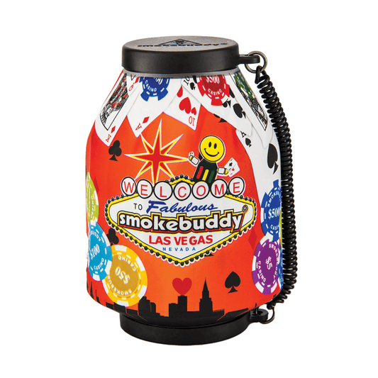 The Las Vegas Smokebuddy Original Personal Air Filter by Vegas Party Favors features playing cards, poker chips, and city skyline graphics. It includes a smiling face and vibrant Fabulous Las Vegas text, ensuring an odorless air experience.